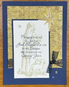 a christmas card with a star on the top and some writing in gold foil over it