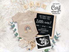 the baby announcement is displayed on a white furnishing with an image of a rainbow