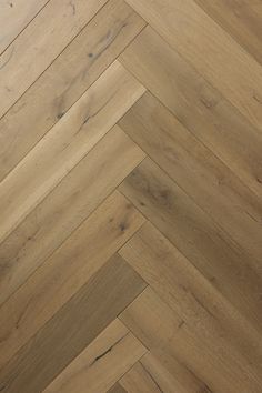 an image of wood flooring that looks like herringbones