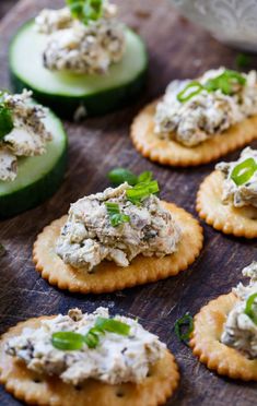 cucumber and cheese appetizers on crackers with mint garnish