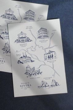 two pieces of white paper with blue ink on them, one is folded and the other has a map of santa fe