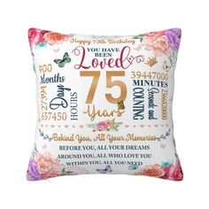 a pillow with the number 75 on it and some words written in different languages,