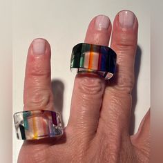 Nwot Two Old School Acrylic Rainbow Colored Rings. The Rings Are Approx Ring Size 4 Or 5. They’re Great Rings!! In The First Photo, The Ring On The Pinky Finger Has Rectangular Shape With An Angle On The Right Side Of The Ring. The Ring On The Ring Finger Is Rectangular In Shape. Modern Multicolor Handmade Rings, Multicolor Adjustable Vintage Rings, Adjustable Multicolor Vintage Rings, Colored Rings, Acrylic Rings, Pinky Finger, Acrylic Ring, Color Ring, Ring Finger