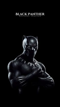 the black panther movie poster is shown in this dark photo, it looks like he's holding his hands on his chest