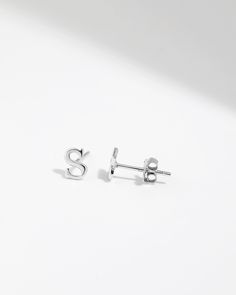 Earrings are sold as a pair (two of the same letters). Material: High-Quality Solid 925 Sterling Silver (Nickel-Free and Lead-Free) Color: Silver Earring Dimension: 0.23 x 0.20 Inches Approximately (Length x Width) Packaging: Complimentary Gift Box and Jewelry Pouch Care Instructions: Sterling silver can be worn in the shower and will not rust. Silver will oxidize naturally, use a gentle silver cleanser or a silver polishing cloth to clean and re-shine as needed. Store your jewelry pieces in an Initial Stud Earrings, Initial Earrings Studs, Initial Earrings, Ziplock Bag, Airtight Containers, Ziplock Bags, Silver Earring, Jewelry Pouch, Free Coloring