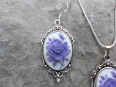 "For sale are beautiful flawless (perfect lavender/purple colored rose with a single bud, on a white background) cameo pendant necklace and matching earrings set The cameos are gorgeous, very detailed They are offered at a reasonable price, make perfect gifts, and are wonderful quality The cameo is set in an ornate tibetan silver setting, and the chain is 22\" .925 silver plated 1.2mm snake chain, with a lobster claw clasp The earrings match perfectly, and the earring hooks are .925 silver plate Beautiful White Background, Cameo Pendant Necklace, Cameo Necklace, Purple Rose, Cameo Pendant, Lavender Purple, Earring Hooks, Purple Roses, Necklace And Earrings