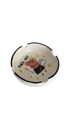 a small white bowl with a cartoon character on the front and black trimmings