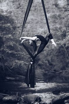 a woman hanging upside down in the air