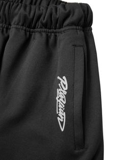 This is a casual and comfortable pants that are made out of high quality polyester and polyurethane blend fabric. With design detail of unique graphic print on the side and logo print beside the pocket, it gives a trendy and casual mood.- Elastic waistband with string- Side welt pockets- Logo print and graphic art print- Adjustable string and stopper on the hem Black Stretch Bottoms With Graphic Print, Black Hip Hop Sweatpants With Side Pockets, Black Bottoms With Letter Print For Streetwear, Black Letter Print Bottoms For Streetwear, Streetwear Bottoms With Comfort Waistband, Sporty Graphic Print Bottoms For Streetwear, Black Stretch Sweatpants With Hip Pockets, Black Urban Bottoms With Letter Print, Urban Black Pants With Letter Print