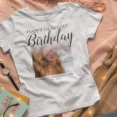 Celebrate and honor your loved one’s memory with a unique and special tribute - the ‘Happy Heavenly Birthday’ Memorial T-shirt. Featuring a meaningful phrase, a photo of your loved one, their name, and their birth and death dates, this T-shirt is sure to be a cherished keepsake. Made with a white background, you can customize the font style, size, and color by clicking the ‘Customize Further’ link after you’ve personalized the T-shirt. Make this a special remembrance with a meaningful tribute. Heavenly Birthday, Happy Heavenly Birthday, Tshirt Crafts, Birthday Tshirts, Birthday Photo, Font Style, 3d T Shirts, Font Styles, Birthday Photos