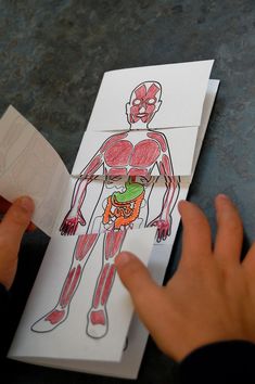 someone is cutting out an image of a human body