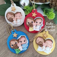 three christmas ornament ornaments with the image of two people holding a baby in their arms