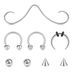 an assortment of different piercings on a white background