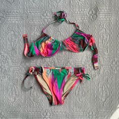 Madewell Electric Ikat Bikini Set. Madewell J.Crew Colorful Bikini Set. Underwire Halter Bikini Top With Side Tie Bikini Bottoms. Stunning Bow Detailing On The Bikini Bottoms. Stripe Bikini Set. Brown, Blue, Green, Orange, Purple, Magenta Color. Bustier Bikini Top. Balconette Bikini Top. Underwire Bikini. Halter Top Bikini. Side Tie Bikini Bottoms. Perfect Condition. Bikini Top Is A Size 36 B Bikini Bottoms Are A Size Small 84% Nylon 16% Spandex. #Bikini #Swim #Bows #Stripes #Retro Adjustable Multicolor Tie-side Swimwear Bottom, Adjustable Multicolor Tie-side Swimwear, Multicolor Adjustable Swimwear For Poolside, Adjustable Multicolor Swimwear For Poolside, Adjustable Multicolor Swimwear For Sunbathing, Multicolor Stretch Tankini With Tie-side Bottom, Multicolor Tie-side Bottom Tankini For Pool, Multicolor Tie-side Tankini For Pool, Multicolor Tie-side Swimwear For Beach Party