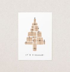 there is a christmas tree made out of boxes on top of each other with the words it's x - masalaba