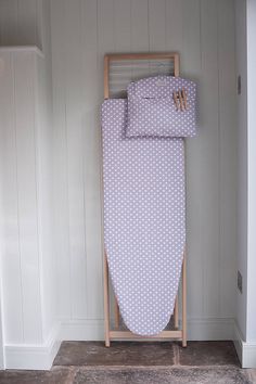 an ironing board in the corner of a room