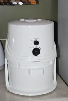 a white machine sitting on top of a counter