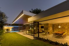 an outdoor dining area is lit up at night