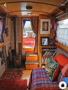 the interior of a small home with wood paneling and colorful decor on the walls