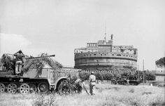 an old black and white photo of men in front of a tank