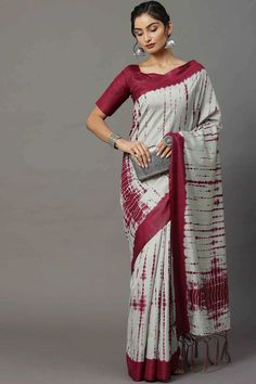 Product Features: Saree Color: Grey Blouse Color: Magenta Saree Fabric: Bhagalpuri Silk Blouse Fabric: Bhagalpuri Silk Saree Work: Tassels and Latkans Saree Style: Block Print Saree Pattern: Printed Saree Print: Shibori Blouse Print Or Pattern: Solid Saree Boarder: Printed Size Description: 5.5 mtr Saree & 0.8 mtr blouse, Free Size Wash Care: Hand Wash Occasion: Daily, Casual Disclaimer: There will be slight difference in digital to actual image Semi-stitched Cotton Saree With Bandhani Print, Multicolor Cotton Pre-draped Saree With Zari Work, Semi-stitched Cotton Pre-draped Saree For Diwali, Wedding Cotton Saree With Bandhani Print, Cotton Multicolor Pre-draped Saree For Diwali, Multicolor Cotton Pre-draped Saree, Festive Semi-stitched Cotton Pre-draped Saree, Transitional Red Cotton Saree, Unstitched White Saree With Bandhani Print