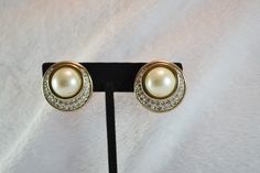 These luscious clip on earrings were designed by Benedetto Panetta, who designed for Trifari before starting his own company in 1945. Known for his quality and beautiful designs, these earrings are a great example of his work. Perfect for a wedding, or any special occasion, these earrings are sure to accent any special outfit! They will come to you in a gift box, ready for giving! These earrings measure almost an inch across. For more lovely vintage accessories, please visit: www.etsy.com/shop/C Glamorous Clip-on Earrings For Formal Events, Glamorous Clip-on Earrings For Formal Occasions, Glamorous Clip-on Earrings For Formal, Elegant Round Rhinestone Clip-on Earrings, Safari Theme Birthday, Own Company, Vogue Sewing, Button Earrings, Vintage Costume Jewelry