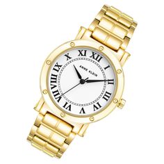 Experience elegant style with this Anne Klein women's watch. A glossy white dial and an eye-catching goldtone band accent a durable goldtone alloy case. The quartz movement and push button clasp to provide convenience and reliability, while the 100 feet water resistance allows worry-free wear. Luxuriously radiant, this watch is perfect for any occasion. Movement Type: QuartzCase Diameter: 36 mmCase Thickness: 8.4 mmCase Material: AlloyCase Colour: Nickel compliant goldtoneCrystal Material: GlassDial Colour: White GlossyBand Material: AlloyBand Colour: GoldtoneBand Width: 18 mmBand Length: IC 7"Water Resistance: 100 feetClasp Type: Push Button ClaspWarranty: 2 Year International Manufacturer's Warranty Anne Klein Watch, Heart Watch, Field Watches, Skeleton Watches, Gold Alloys, Rose Gold Band, Classic Watches, Women's Watch, White Dial