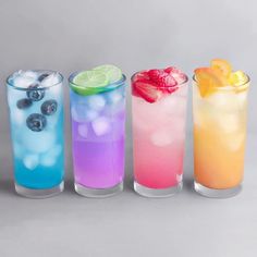 four different types of drinks are lined up