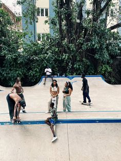 a group of people riding skateboards at a skate park