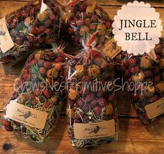 several bags of dried fruit sitting on top of a wooden table in front of a sign that says jungle bell