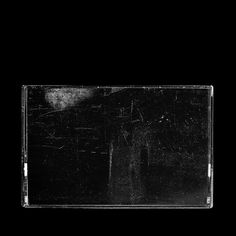 a black and white photo of an empty cd case