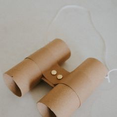 two rolls of toilet paper with buttons on them