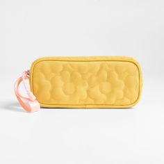 A fun pencil case that's built to handle all the thrills of the day. A pattern of quilted blooms add sunny vibes to the yellow exterior, and the contrasting pink zipper, zipper pull and loop handle give it the perfect finish. Constructed of supremely durable polyester fabric that includes recycled plastic bottles, our roomy, easy-clean case makes it simple to keep all their pens and pencils organized and accessible. Pair with the Quilted Yellow Flower lunch box and matching backpack for a totall Cheap Yellow Pencil Case For School, Cheap Yellow Cute Pencil Case, Affordable Yellow Pencil Case With Zipper, Yellow Travel Pencil Pouch, Yellow Rectangular Zipper Pouch Pencil Case, Yellow Exterior, Kids Pencil Case, Sunny Vibes, Pencil Organizer