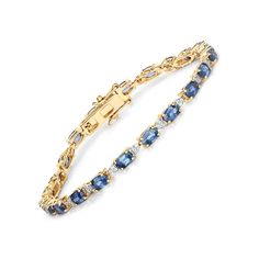 Liven up your look with a colorful collection of luscious jewels. This tennis bracelet trails the wrist with 5.03 ctw Genuine blue sapphire oval in 14k yellow gold with fine finish. An all-time favorite gemstones in an all-time classic silhouette. Box with tongue and safety clasp, 7.00 inches length blue sapphire tennis bracelet. Classic Blue Round Gold Bracelet, Classic Blue Gold Bracelet, Blue Oval Diamond Bracelet With Jewels, Elegant Blue Diamond Bracelet In 14k Gold, Blue Oval Bracelet For Anniversary, Blue Oval Bracelets For Anniversary, Blue Jubilee Gold Bracelet In Fine Jewelry Style, Elegant Blue Jubilee Gold Bracelet, Blue Oval Diamond Bracelet With Gemstone