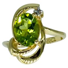 Vintage 2.02 Carat Peridot & Diamond Leaf Fashion Ring 14k Gold. Creative design with a center peridot weighing approx 2 carats and a single diamond on top connecting as a leaf design. Very nice design ring made in 14k solid gold. The ring is a size 6 and weights approx 3.3 grams. The ring measures 16.75mm X 10.85mm Leaf Fashion, Peridot Jewelry, Vintage Fine Jewelry, Gold Rings Fashion, Fashion Ring, Moda Vintage, Nice Design, Mode Vintage, 2 Carat