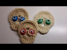 two crocheted items with googly eyes on them