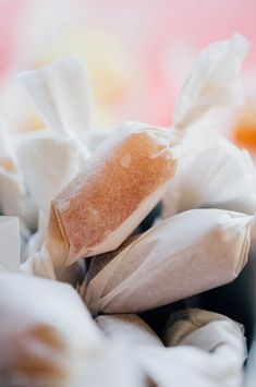 a pile of white and brown paper sitting on top of a table