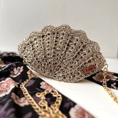 ➡️  Metallic Gold Evening Bag, Shiny Bag Wedding Clutch, Gold Clutch Purse, Rhinestone Purse Small Tote Bag, Zipper Clutch Bag, Luxury Bag 🪡 Mini Gold Luxury bag made from metallic rope. This fabulous handmade crochet bag will look stunning with an elegant style perfect for a special occasion, or with casual clothing for a stylish touch to your everyday look. Uniquely handcrafted of the latest fashion. Inside lining is made of the highest linen fabric quality and zipper closure. Shoulder stainless steel strap is removable. It's perfect gift for any occasion. Dimensions: 11x6 inch / 28x15 cm and with 25 inch / 64cm length removable stainless steel strap. 🛫 Our production time is 5-7 days. But we try to ship your order as soon as possible.  📢 Our special offer for you:  Buy 2 Get 40% off, Gold Clutch Purse, Rhinestone Purse, Gold Evening Bag, Gold Clutch, Wedding Clutch, Small Tote Bag, Luxury Bag, Bag Luxury, Small Tote