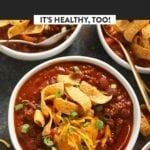 three bowls of chili with tortilla chips on the side and it's healthy too