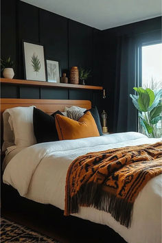 black accent wall in bedroom with bed with burnt orange accent colors cream bedding wall shelf above bed Black Walls Bedroom Ideas, Black Wall Room, Black Painted Bedroom, Black Feature Wall Bedroom, Bedroom Black Walls, Dark Wall Bedroom, Moody Dark Bedroom, Black And Rust Bedroom, Black Accent Wall Bedroom