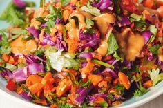 a white bowl filled with salad and dressing