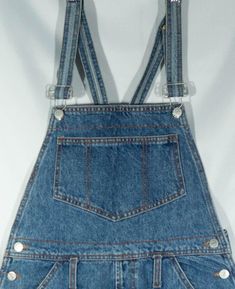 Here's a pair of classic made in U.S.A. 1980's Bongo label overalls jeans cutoff shorts that have a cool painter cut. You will love wearing this comfy pair of great collectible shorts overalls cutoffs for your artful, tinkering and green thumb ways. These casual Bongo dungarees have a relaxed style that are on trend in look and they are comfortable, with pockets, metal buttons and logo patch. These retro shortalls are original overalls cut offs and the denim is of really great vintage quality. T Cotton Cutoff Shortalls With Pockets, Casual Denim Shortalls With Belt Loops, Retro Dark Wash Shortalls With Pockets, Retro Bottoms Overalls With Pockets, Retro Denim Bib Front Shortalls, Denim Blue Retro Overalls, Retro Denim Blue Overalls, Retro Blue Shortalls With Pockets, Vintage High-waist Overalls With Pockets