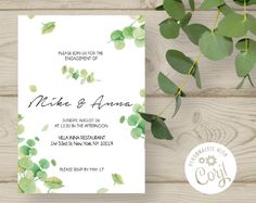 the wedding card has green leaves on it