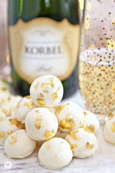 This Champagne White Chocolate Truffle recipe will make you want to bust out the bubbly! Luscious white chocolate is combined with champagne to produce silky-smooth truffles that melt in your mouth. These beautiful homemade truffles are perfect for New Year’s Eve, Valentine’s Day, or any celebration! #sugarhero #champagnetruffles #whitechocolatetruffles #trufflerecipe