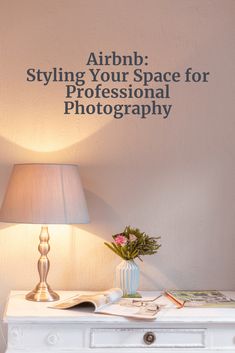 a white table with a lamp on top of it and an advertisement above it that says, arrhb styling your space for professional photography