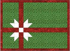 a green and red quilted table topper with an arrow on it's center