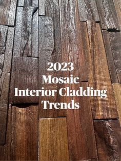 wood flooring with the words mosaic interior cladding trends in white lettering on it