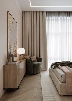 a bedroom with a bed, chair and large window covered in curtains on the windowsill