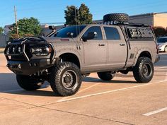 a large gray truck parked in a parking lot