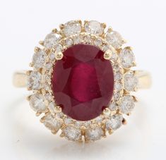 an oval shaped ruby and diamond ring